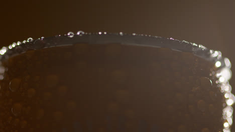 Close-Up-Backlit-Shot-Of-Condensation-Droplets-On-Revolving-Takeaway-Can-Of-Cold-Beer-Or-Soft-Drink-2